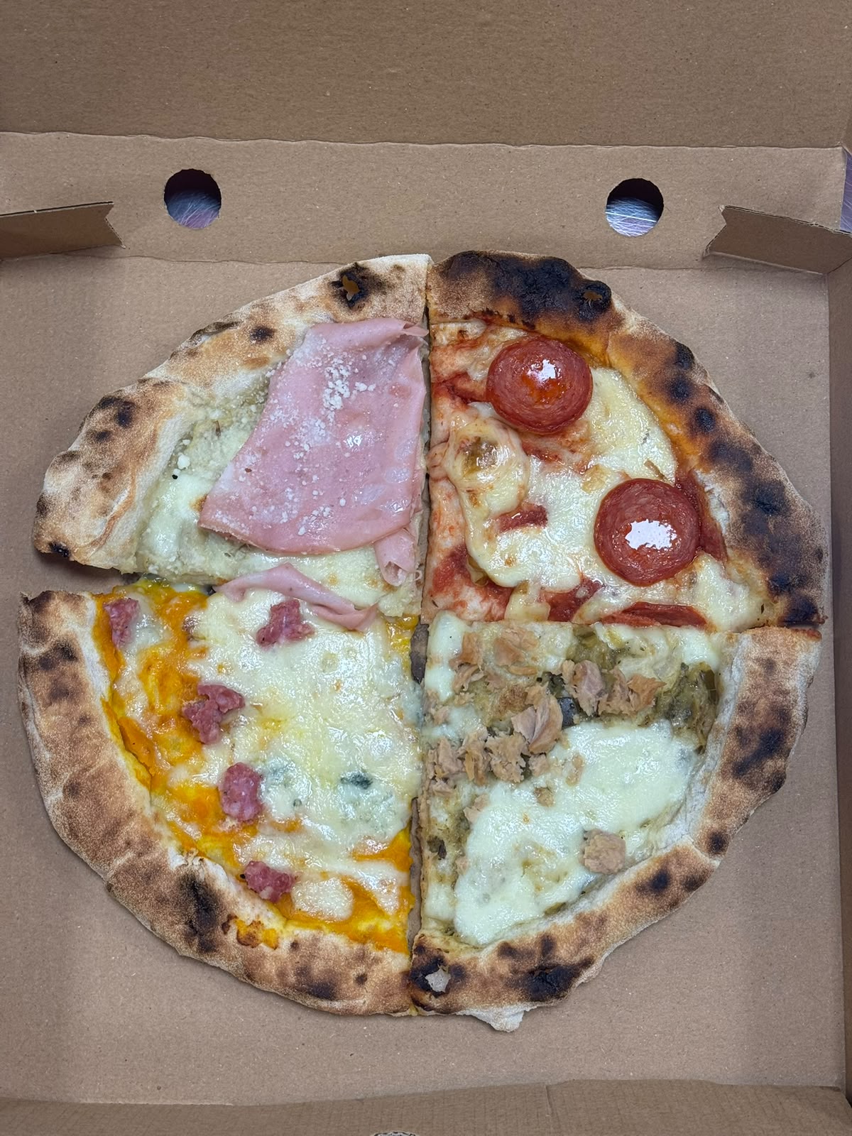 Four different topping combinations on one Italian Secret pizza