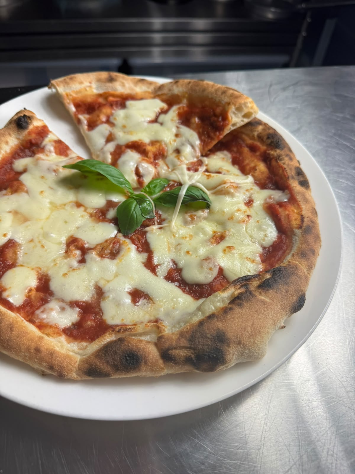 Golden-crusted pizza with melted cheese and basil